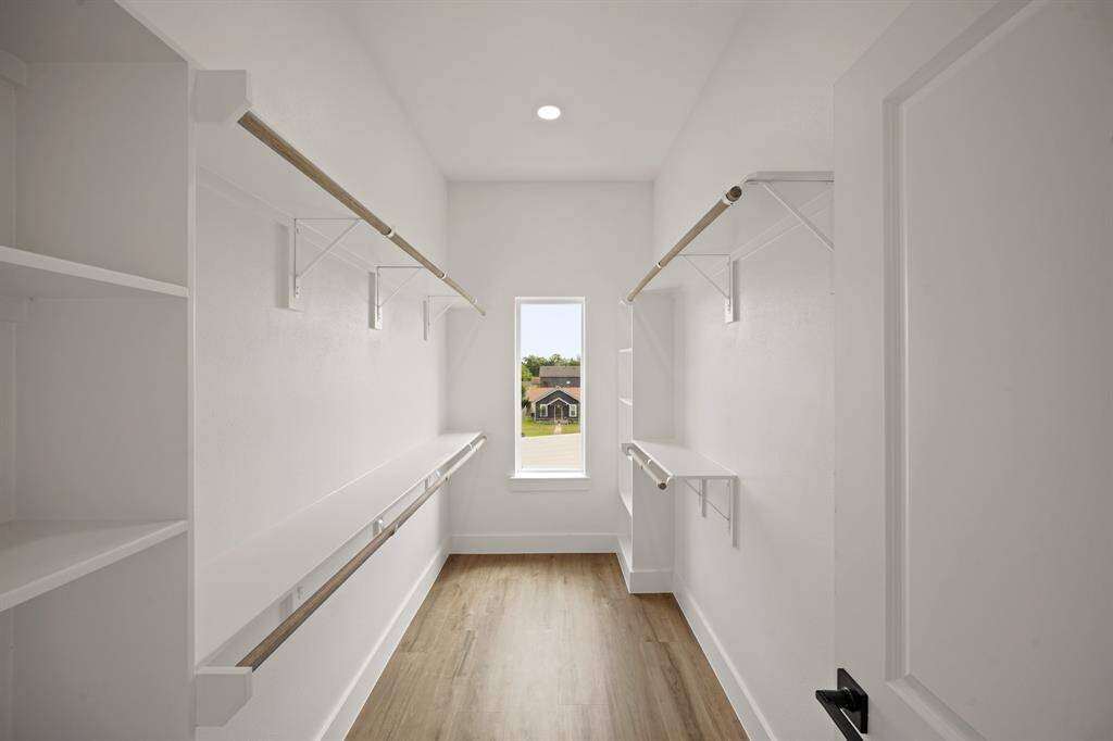 Huge walk-in closet in the primary bathroom.