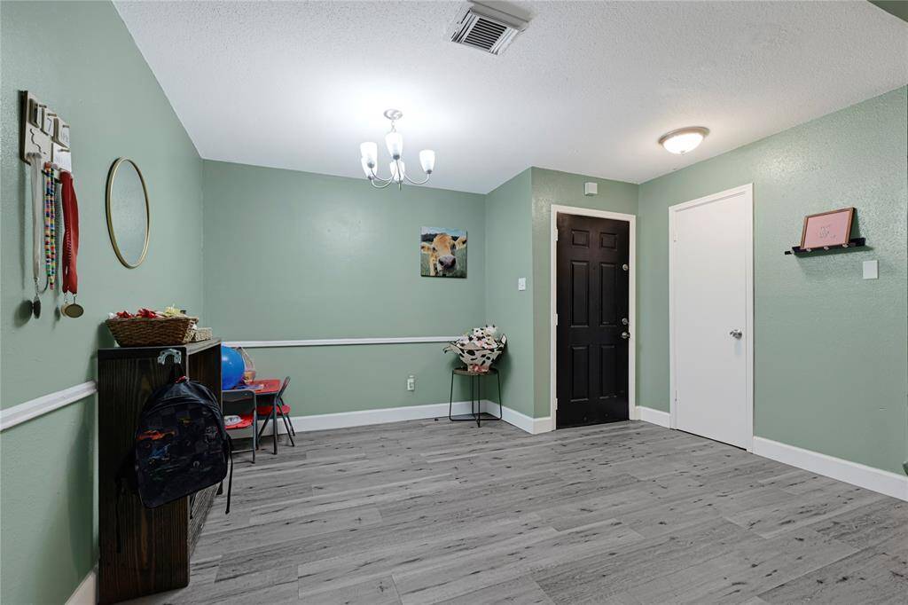 Come on in and be greeted by this large dining room area and a coat closet.
