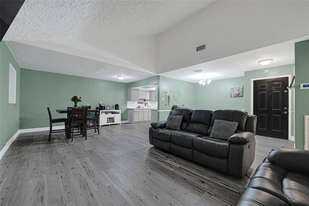 An angled view of the living room, breakfast area, and kitchen!
