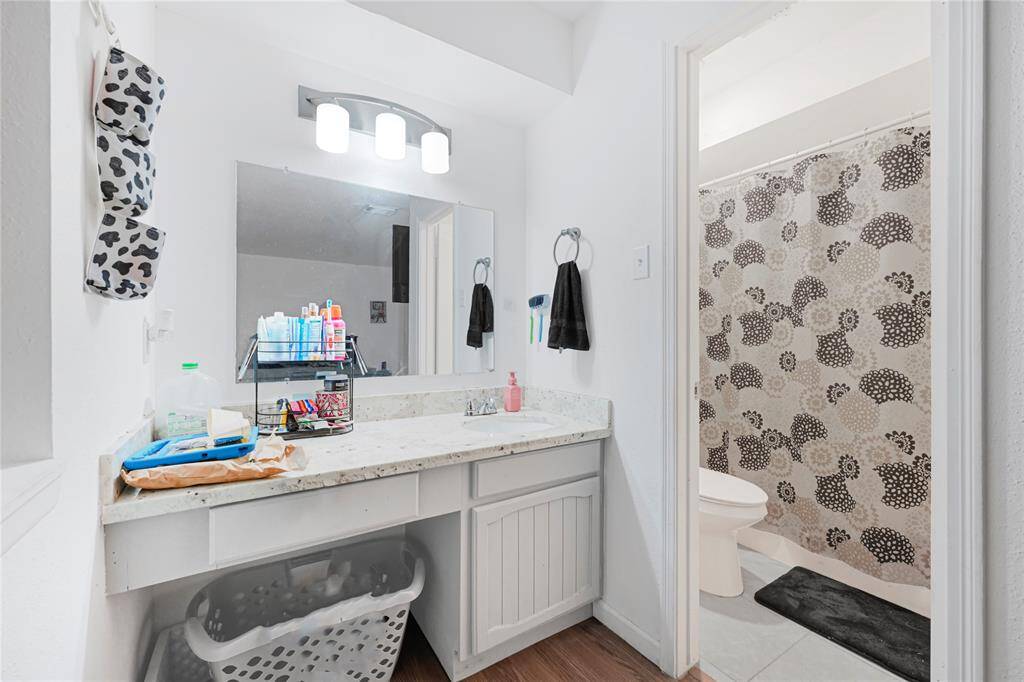 Primary en-suite with your very own vanity seating space. Bathroom offers a shower/bath combo.