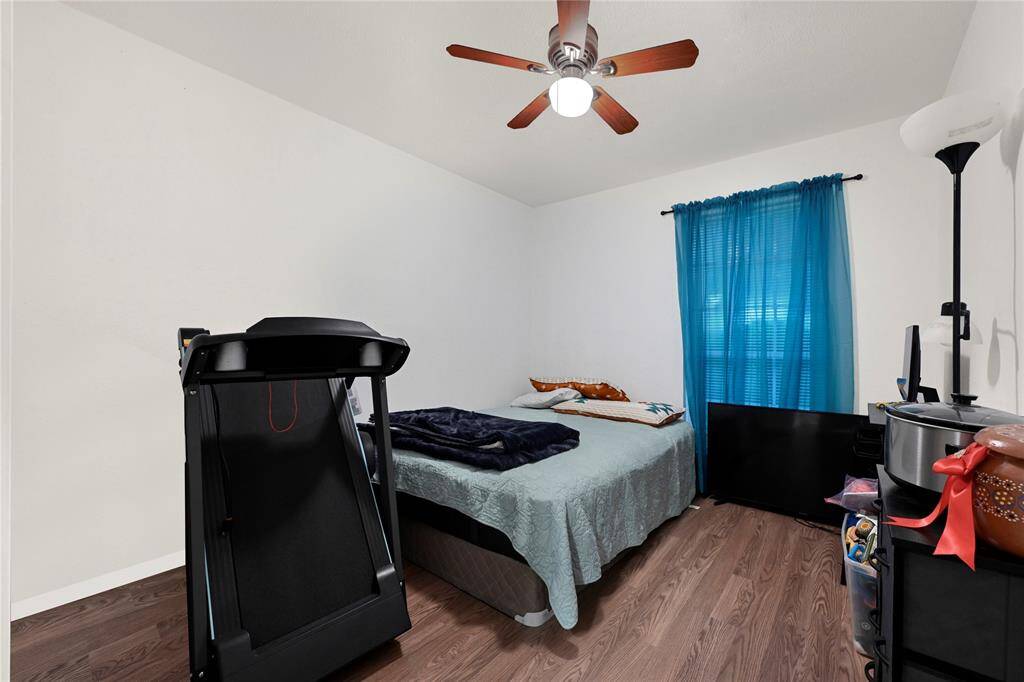 Bedroom number 2 offers a ceiling fan and spacious closet.