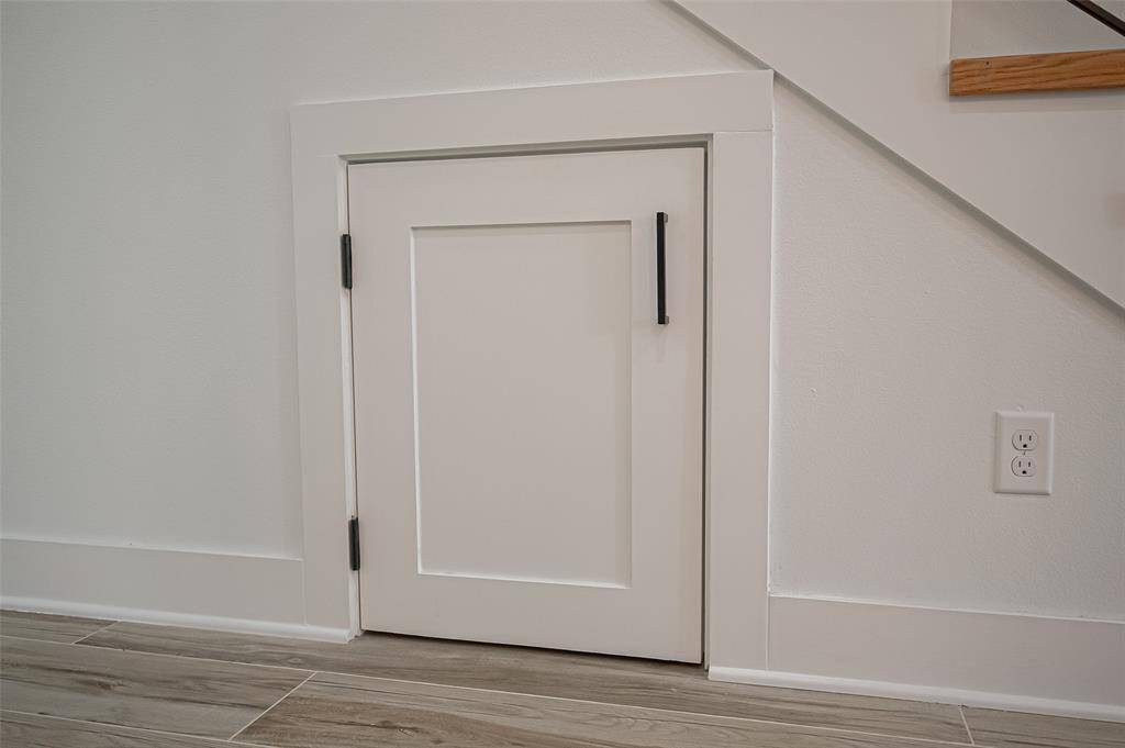 Thoughtfully designed pet retreat tucked under the stairs—ideal for your furry companion’s comfort and style.