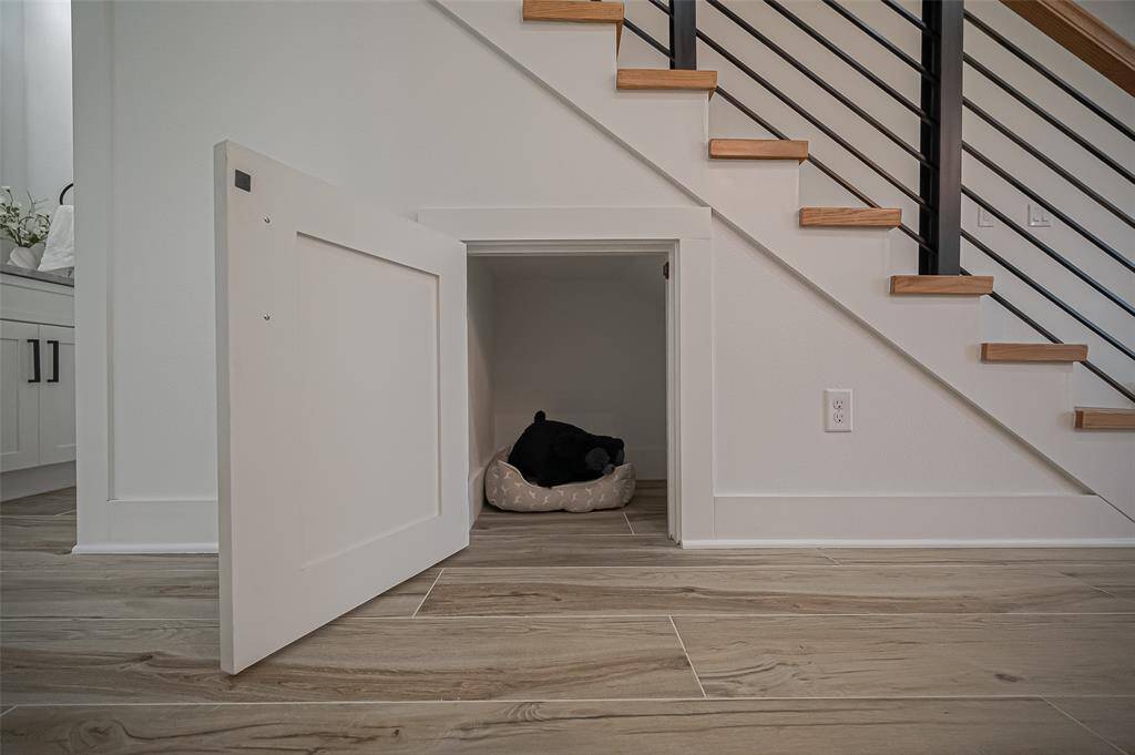 Thoughtfully designed pet retreat tucked under the stairs—ideal for your furry companion’s comfort and style.