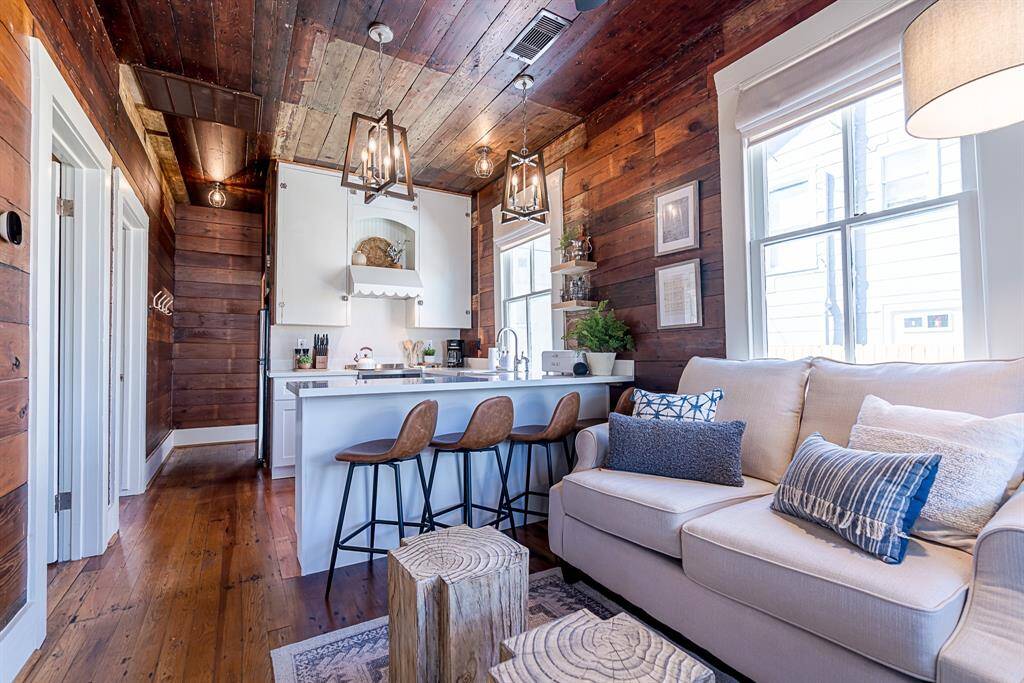 Back House:Enter from a covered front porch to original wood flooring throughout