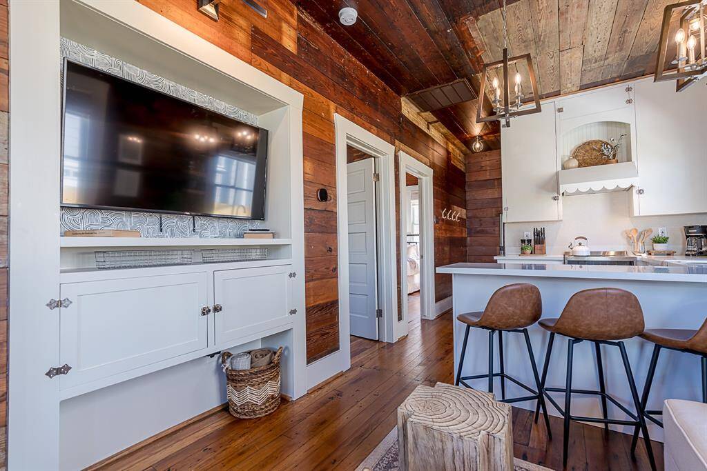 Back House:Enter from a covered front porch to original wood flooring throughout