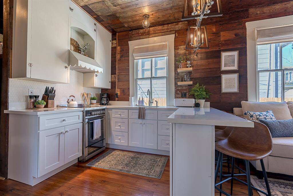 Back House: Chef's kitchen features quartz countertops, stainless steel appliances and a breakfast bar