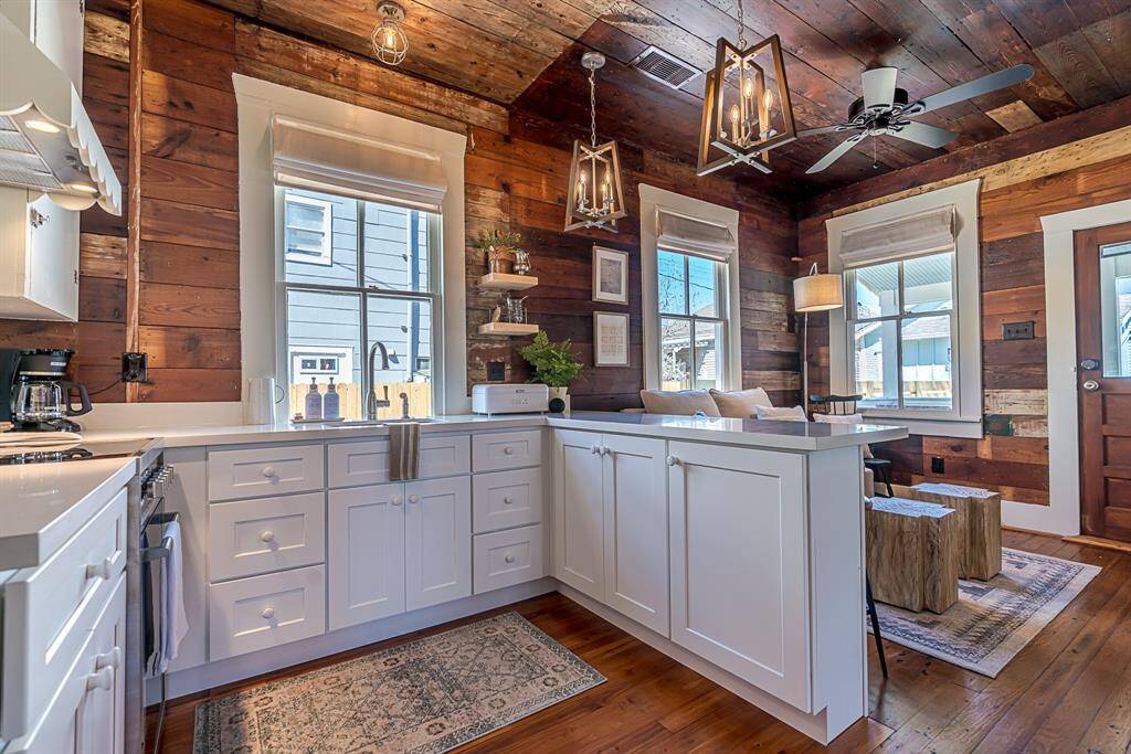 Back House: Chef's kitchen features quartz countertops, stainless steel appliances and a breakfast bar