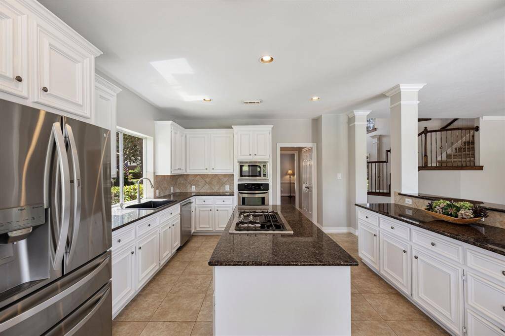 Boasting impressive storage, the center island also features an outlet for easy mixing and prepping with small kitchen appliances. Store cookie cutters and cupcake supplies beneath for impromptu baked goodies, which of course always require an urgent need!