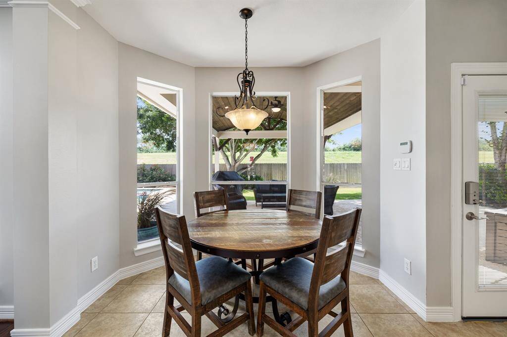 Everyday dining is stylish and bright in the breakfast area. Eat heart-shaped waffles and sausage with the kiddos, as you admire the view of the oasis backyard!