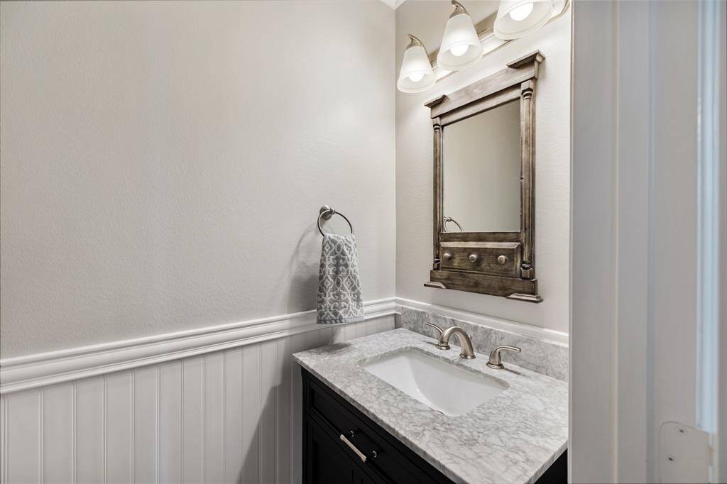 Hospitality is felt throughout the home and the powder room is no exception.