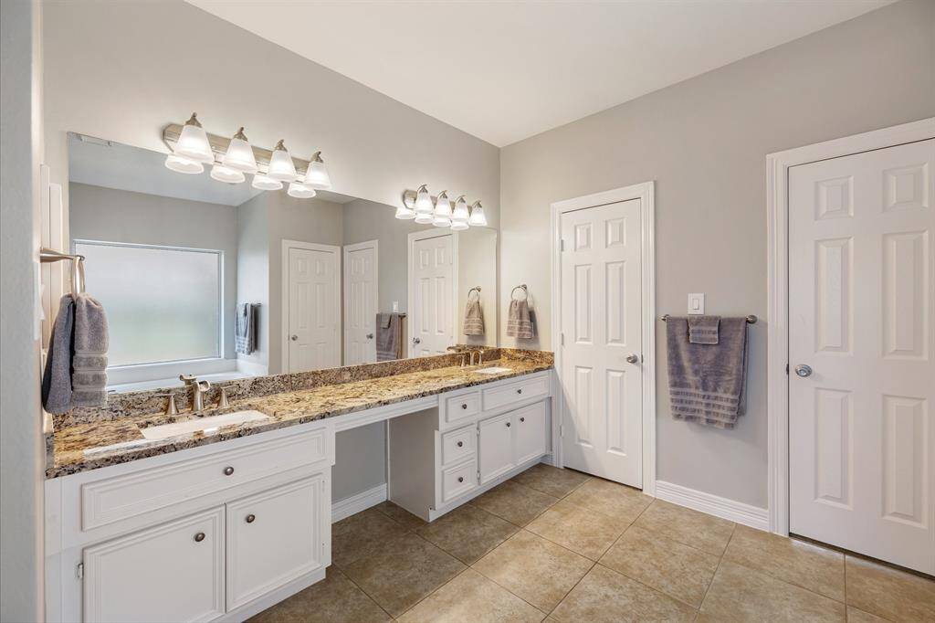Dual sinks ensure both partners have a dedicated area for grooming and self-care! Ample counter space is only enhanced by the tremendous space beneath, which includes multiple drawers of varying sizes and base storage cabinetry!