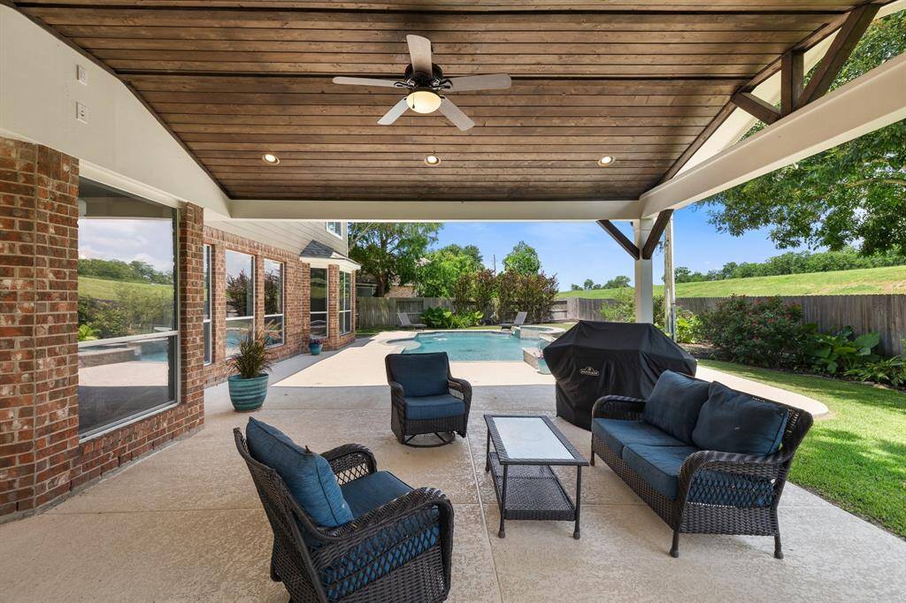 Bask beneath the covered patio and relish in the cooling effects of the outdoor ceiling fans! Even on hot Texas days, this luxurious space affords the ability to enjoy the outdoors in comfort and style.