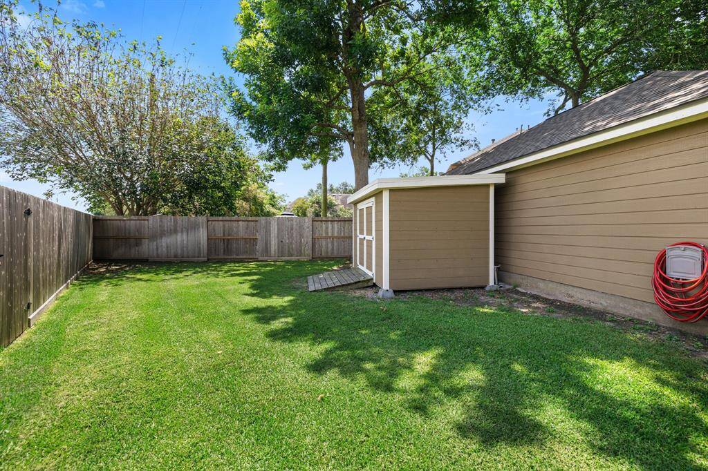 Fully fenced-in, the manicured backyard provides privacy and safety. Go for an evening swim or chat with friends over cupcakes and margaritas!