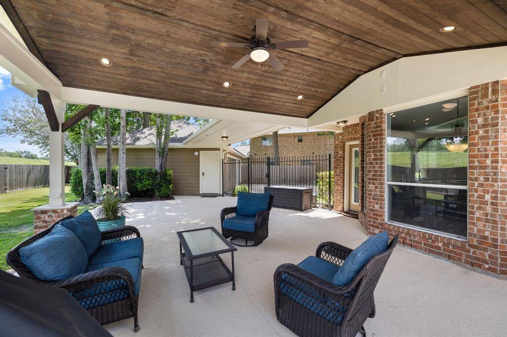 On the weekends or early afternoons, browse the internet on your tablet beneath the cooling ceiling fan! Escape for a moment and recharge in the family room, while simultaneously enjoying the entrancing views of the phenomenal backyard!