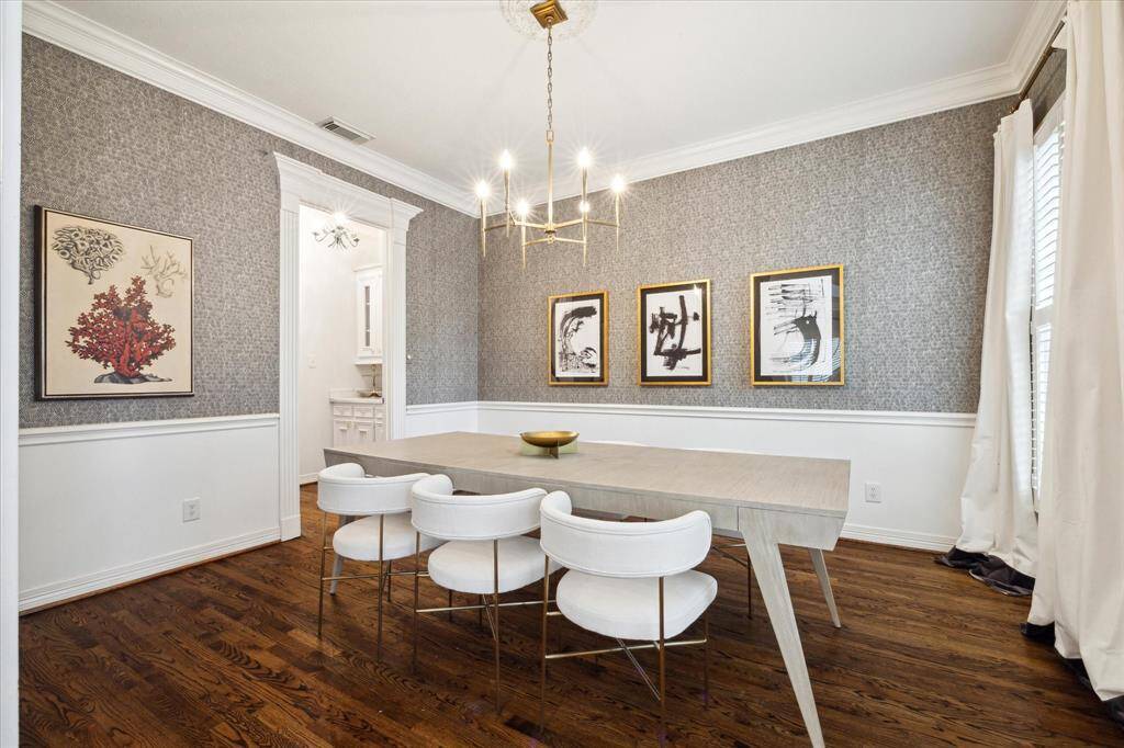 Dining room featuring Zoffany wallpaper, with an exquisite design situated at the front of the home, adjacent to the formal sitting area, ideal for entertaining.