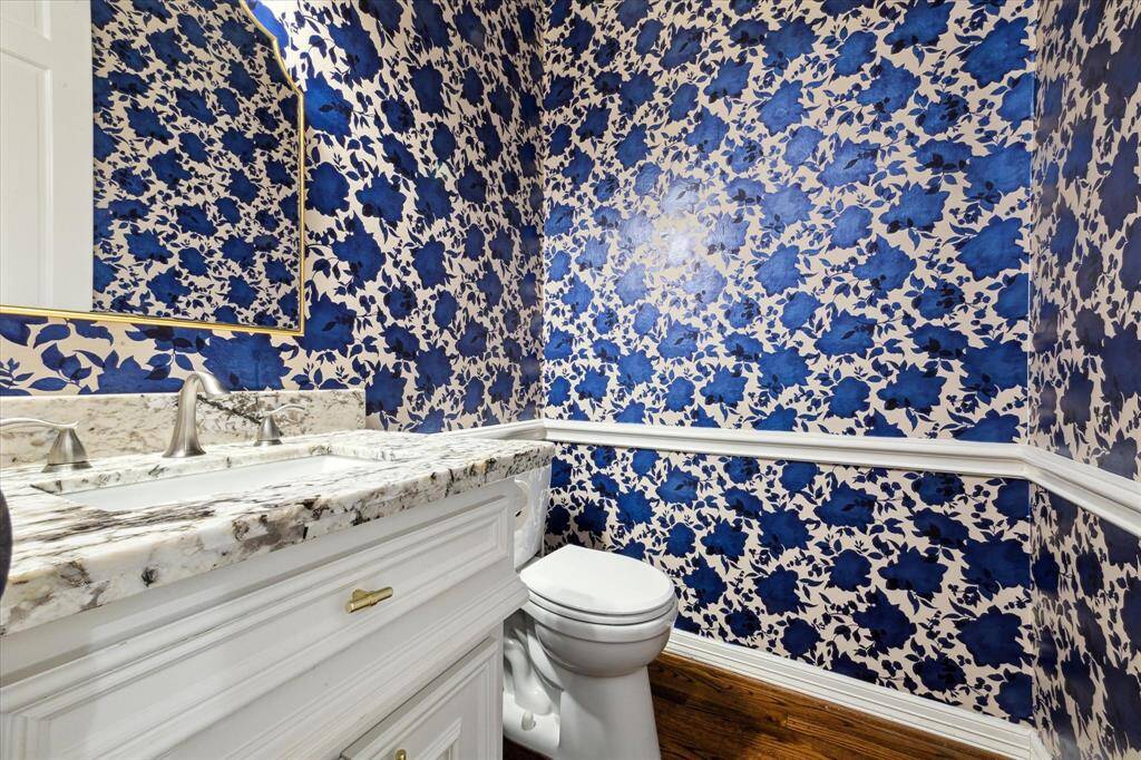 Convenient first-floor half bathroom with stylish finishes.