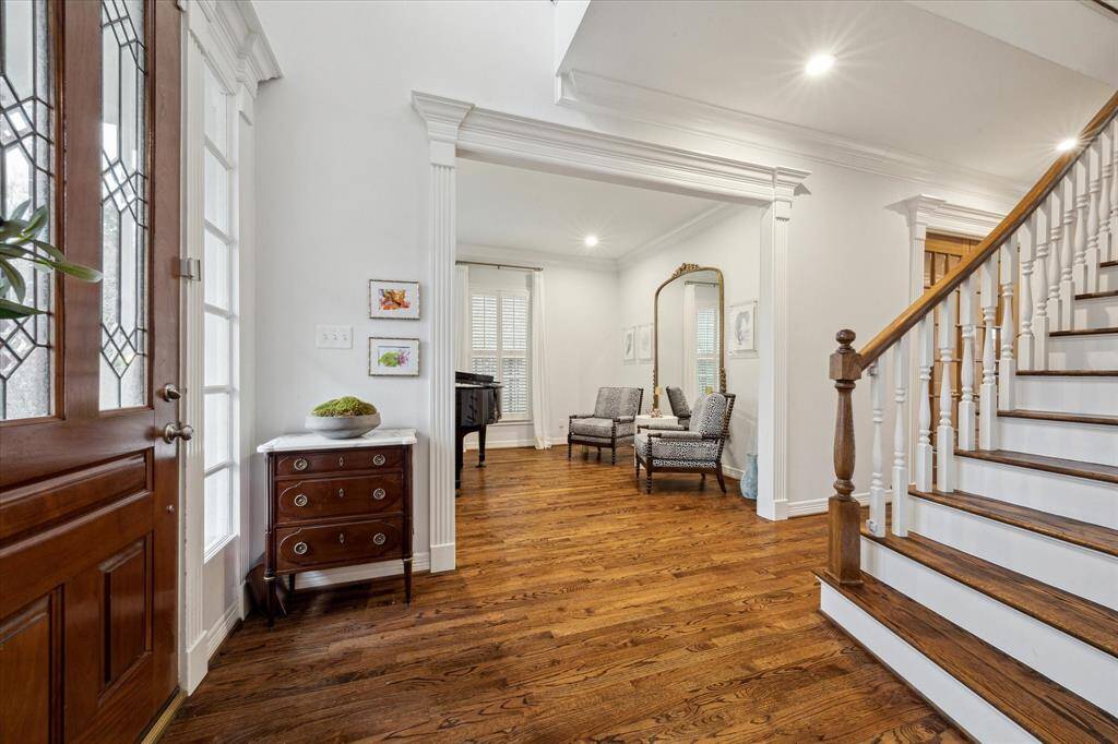 Step into this traditional West University home, welcomed by abundant natural light and elegant formal dining and living areas.