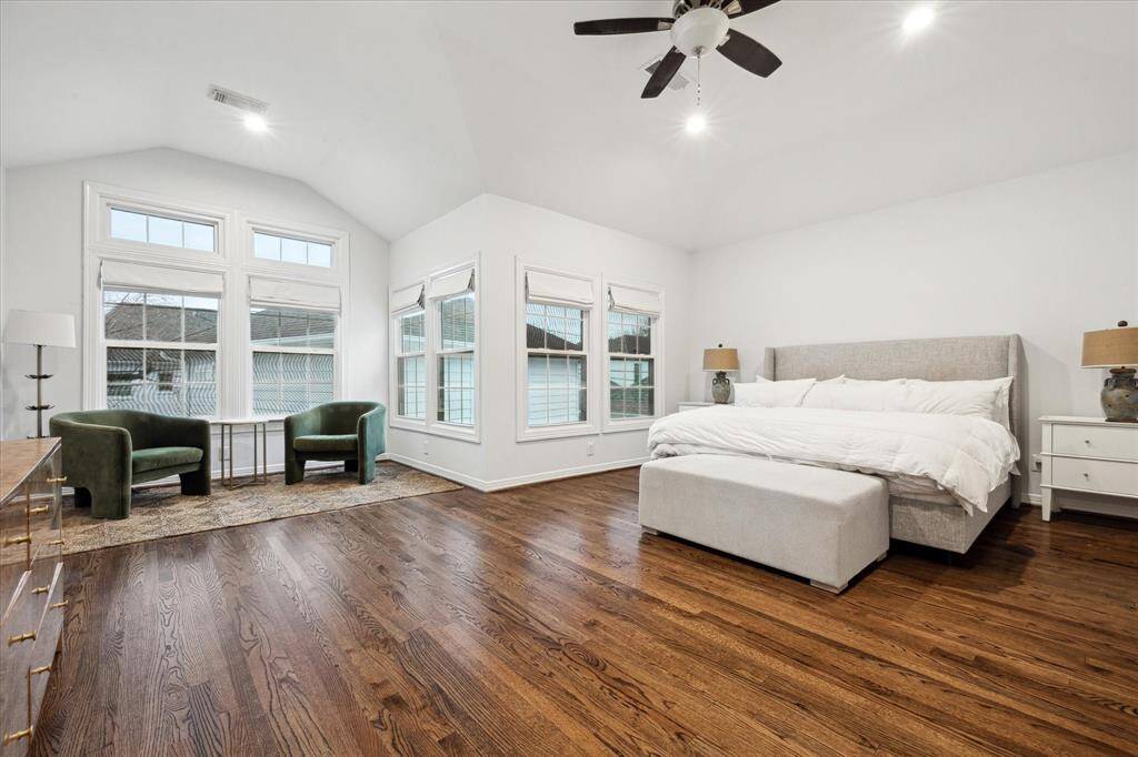 Expansive primary bedroom with ample space for a sitting area and large bed, creating a luxurious retreat.