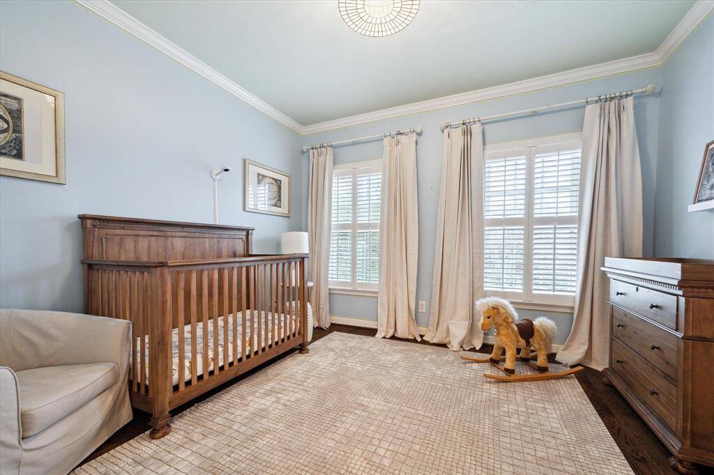 View of the secondary bedroom located at the front of the home, offering generous space and comfort.