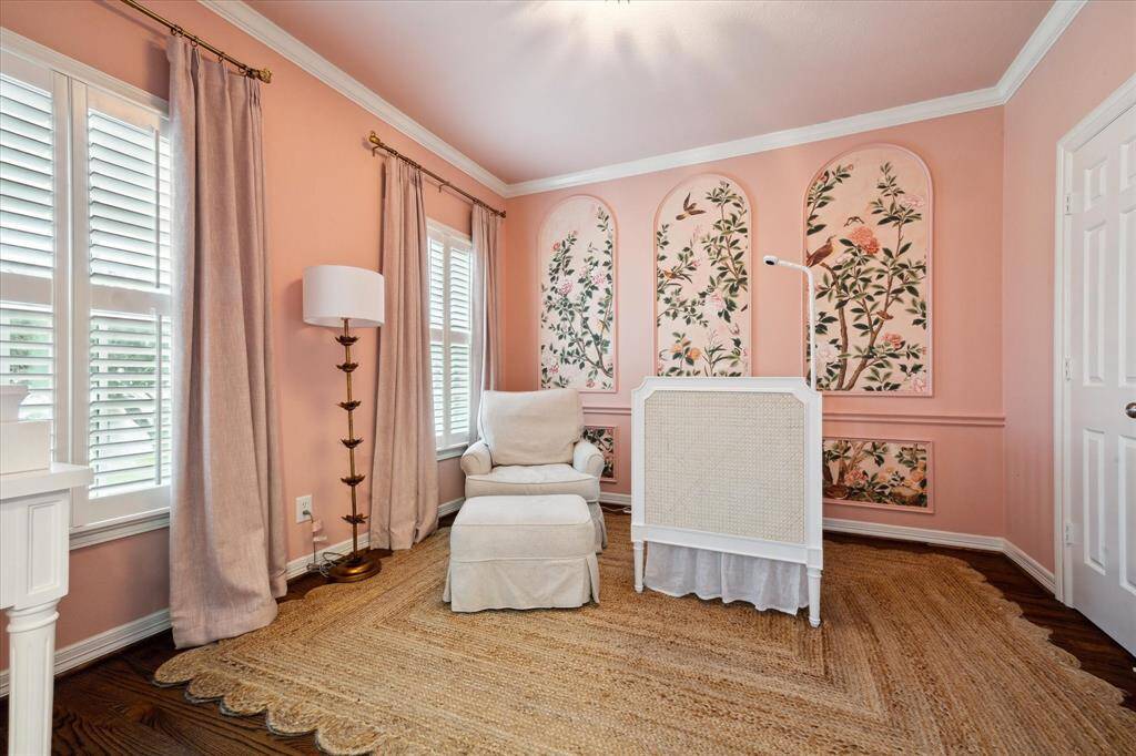 Stylish secondary bedroom featuring Thibaut wallpaper, elegant design elements, and ample space.