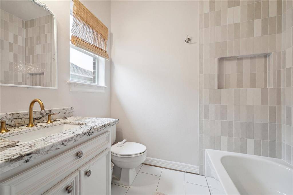 En suite bathroom offering convenience and privacy for this secondary bedroom.