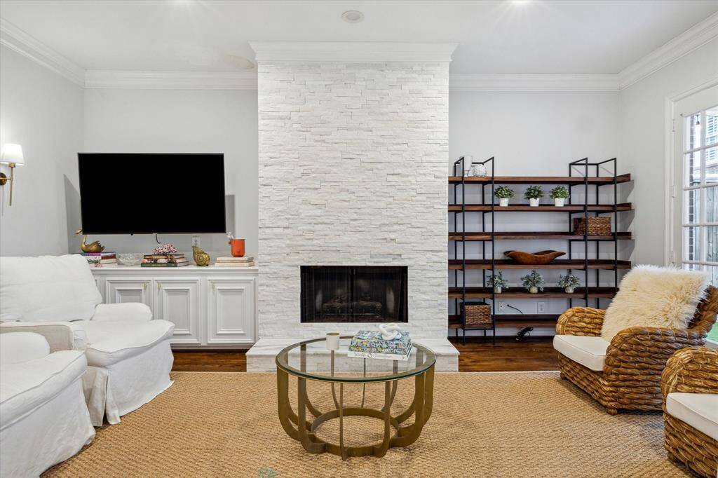 View of the living room featuring a gorgeous fireplace, perfect for cozying up on a cold night.