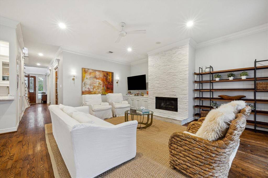 Another view of the living room highlighting its spacious layout and inviting atmosphere.