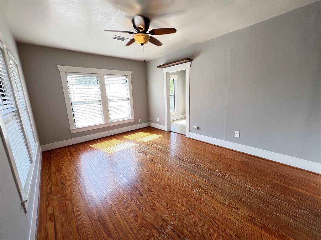 Living room is very spacious and features hardwood floors and plenty of natural light.