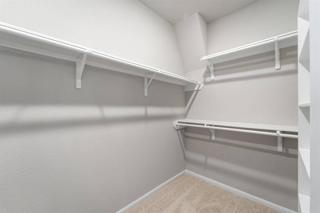 A view of your large primary walk-in Closet