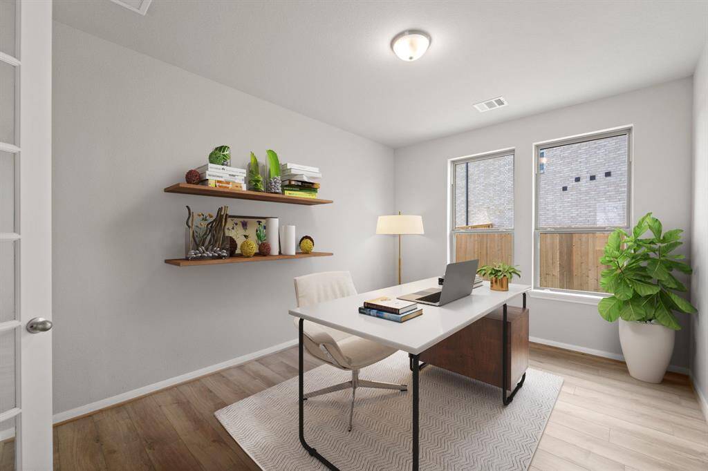 The home office features French doors, beautiful floors, large windows that give a fresh feel, this space promotes focus and creativity.