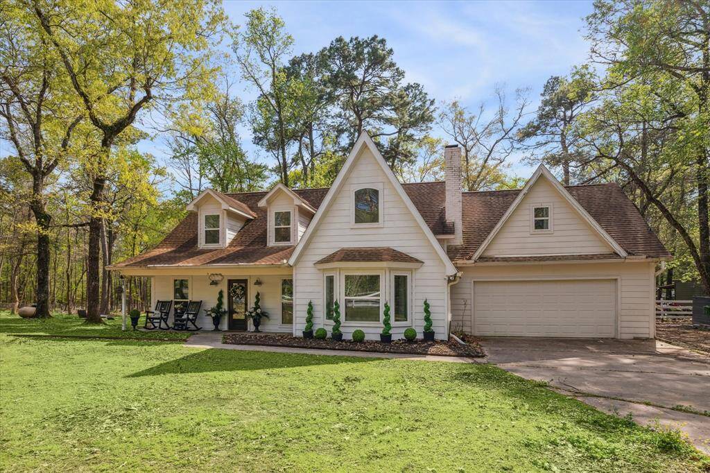 A picturesque rustic farmhouse on over 8 lush fully fenced acres.