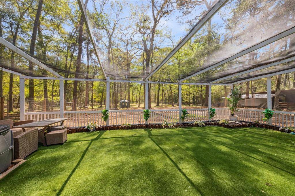 Take in all the scenic views of nature within the extended screened-in porch.