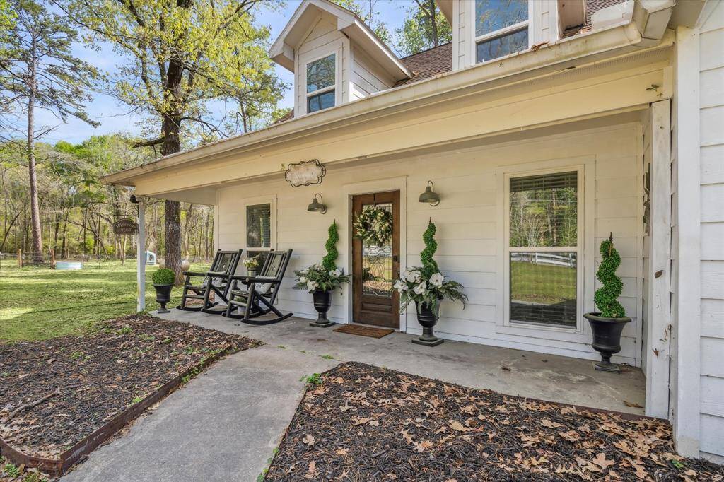 Classic farmhouse-style architecture with a welcoming front porch.