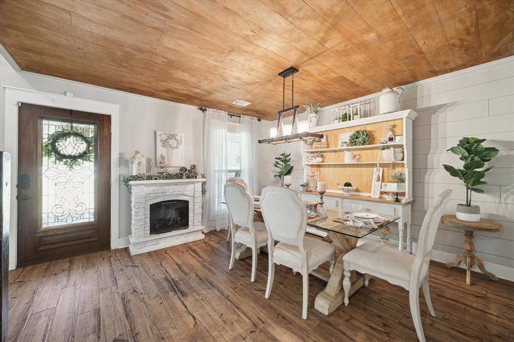 Tile floors throughout the first floor and wood shiplap to complete the farmhouse look.