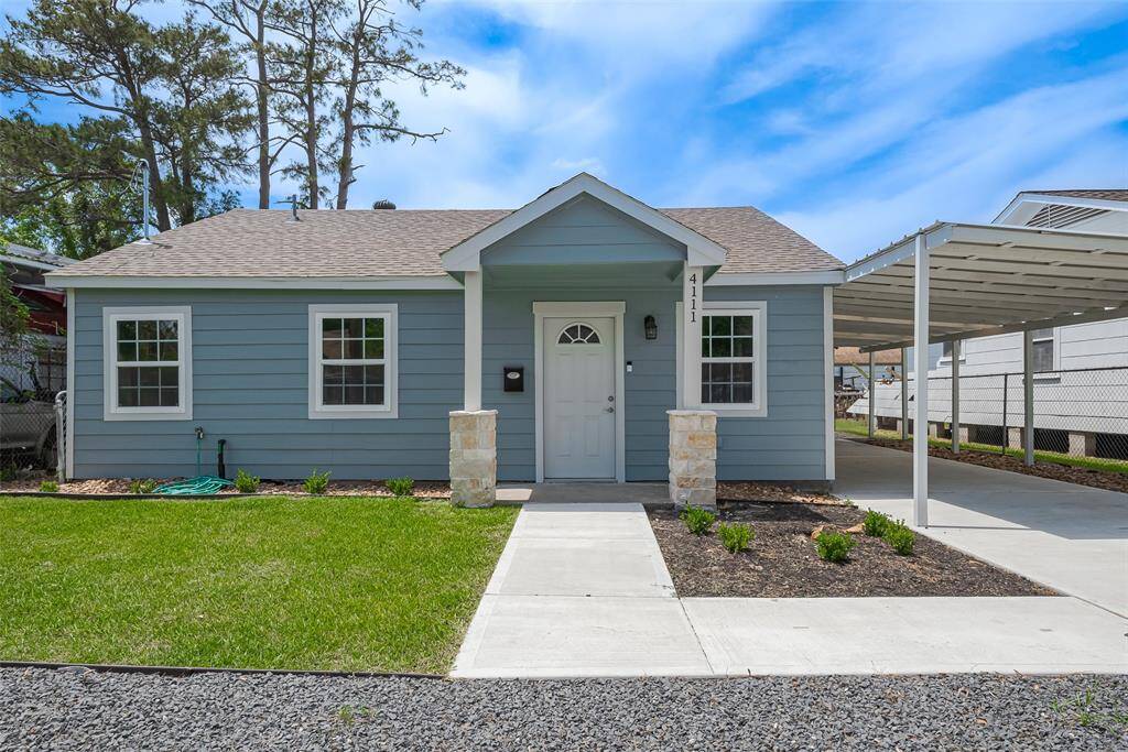 Charming home at 4111 Beggs, featuring a welcoming front porch, fresh landscaping, and a convenient carport. Perfect for your new beginning!