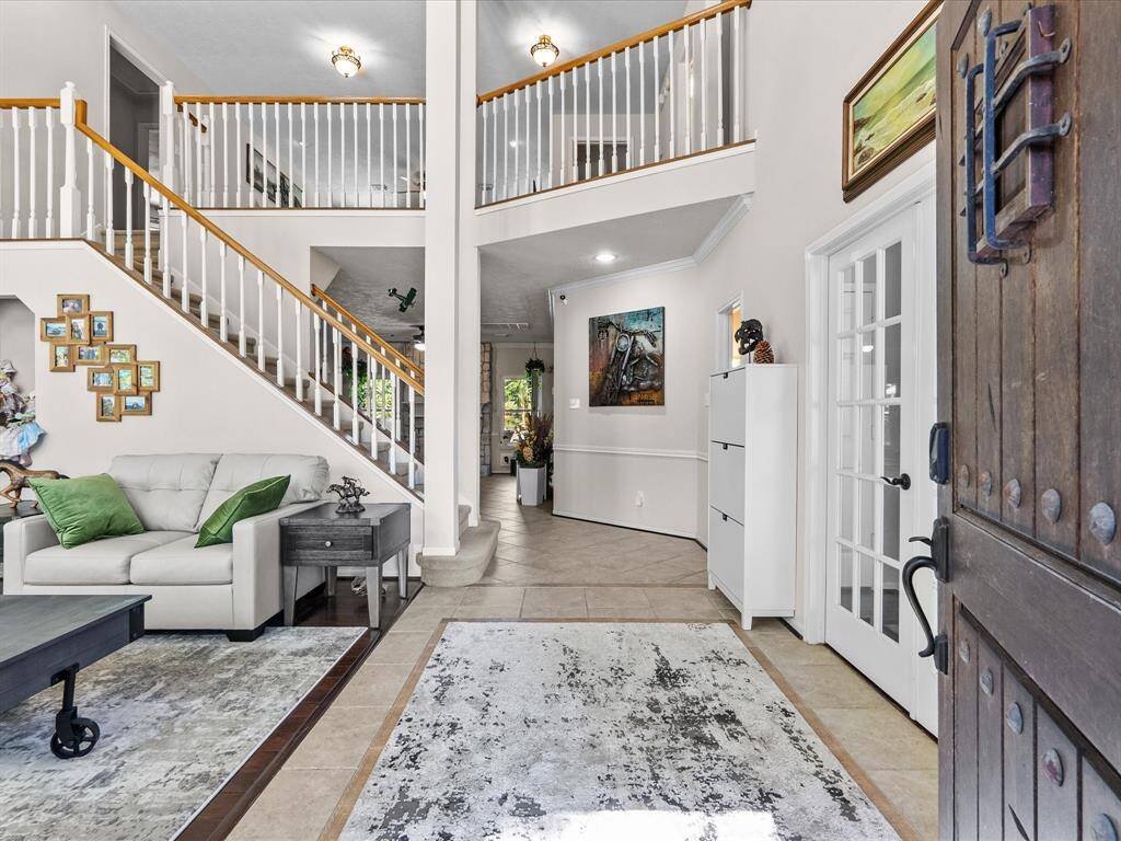As you come in you are greeted with high ceilings and an open floor plan