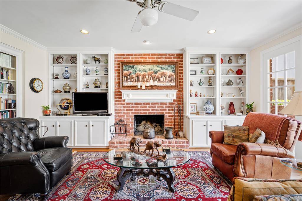 Den directly off the kitchen is complete with built ins and a wood burning fireplace.