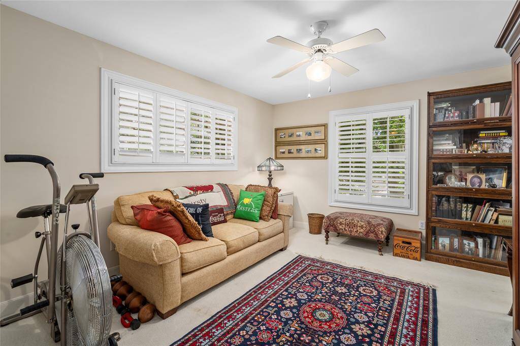 One of three guest bedrooms with plantation shutters.
