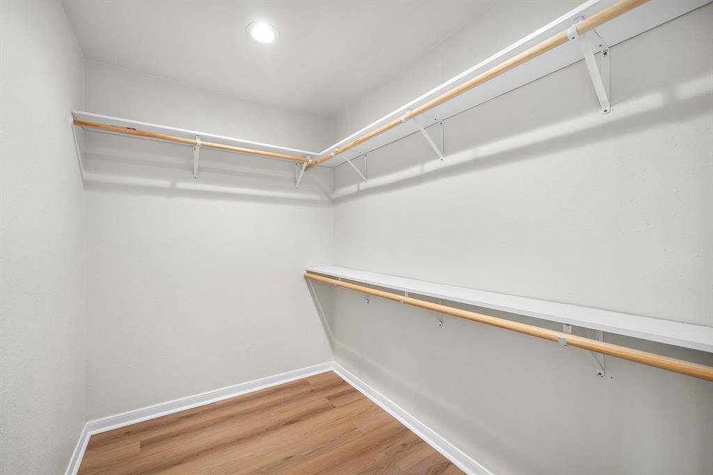Primary walk in closet.