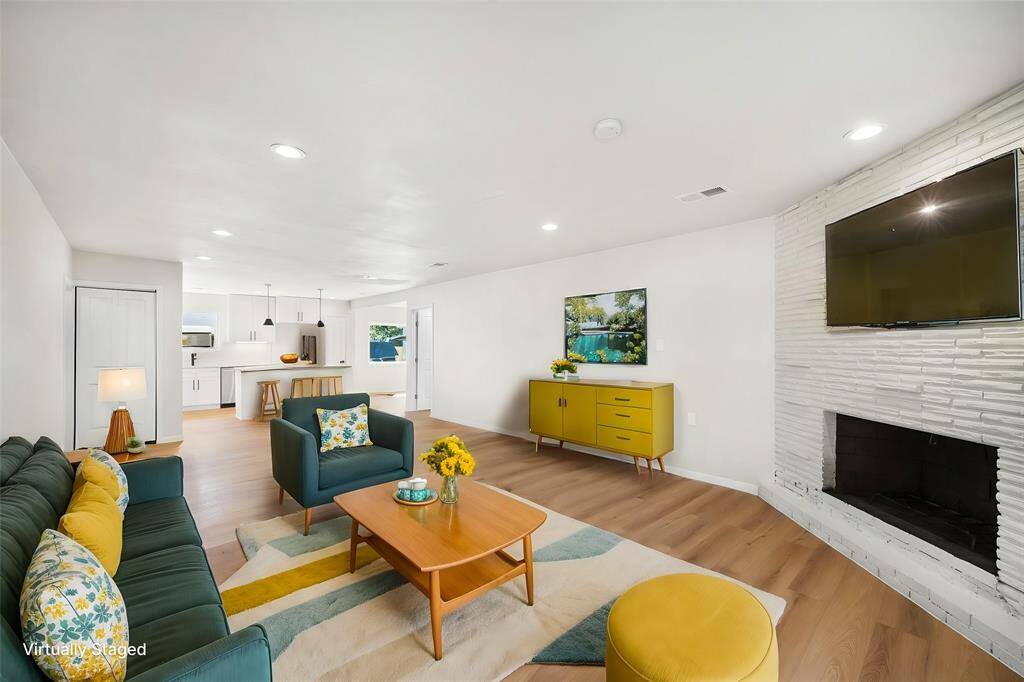 Virtually staged completely redone living room and kitchen.