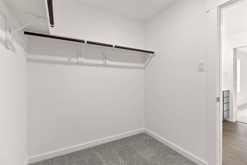 As you glide through the spacious layout, you'll appreciate the thoughtful design elements that make getting ready a joy.