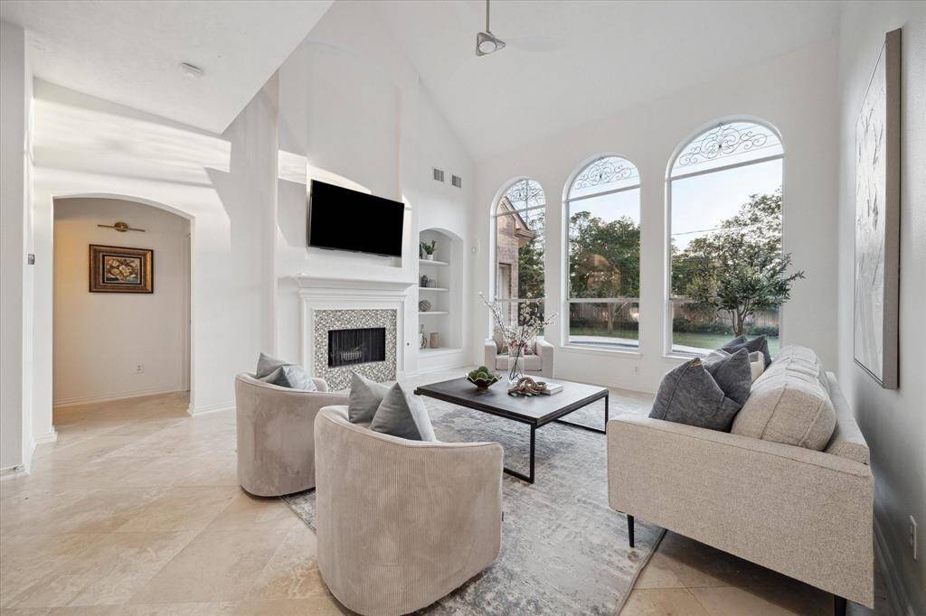 The Kitchen is open and has tons of light. It has room for a sitting area and a breakfast table. The kitchen overlooks the backyard and pool.