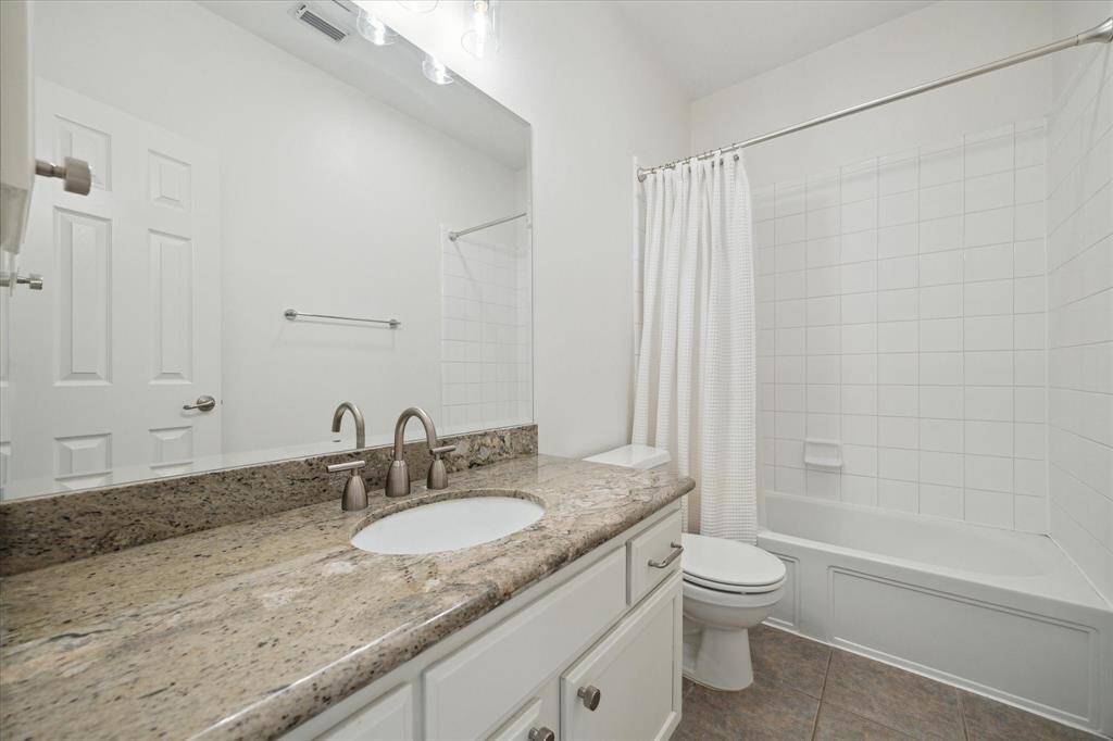 Laundry Room is located just off the kitchen and has lots of storage.