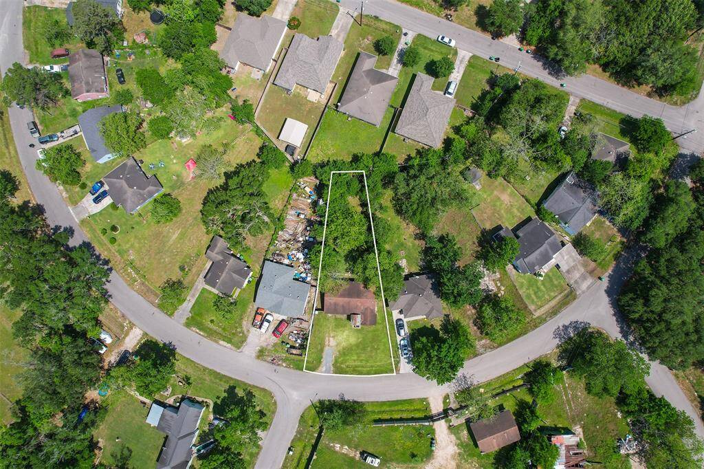 This elevated perspective highlights the generous 0.37-acre lot in context with neighboring properties, showcasing its prime location within a developing residential area.