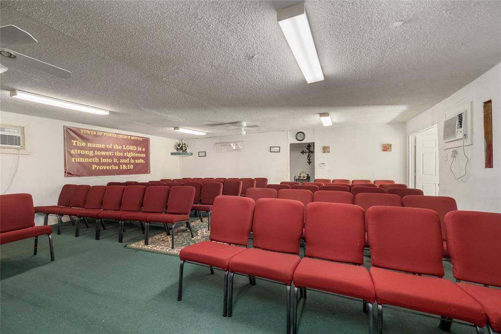 This view illustrates spacious room and the door in back that leads to the two restrooms and storage/closet area. To the right is the main entrance and receiving foyer.