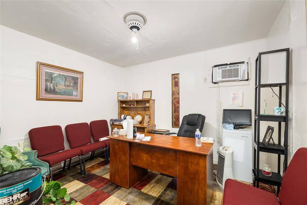 One of the rooms is currently being used as an office.