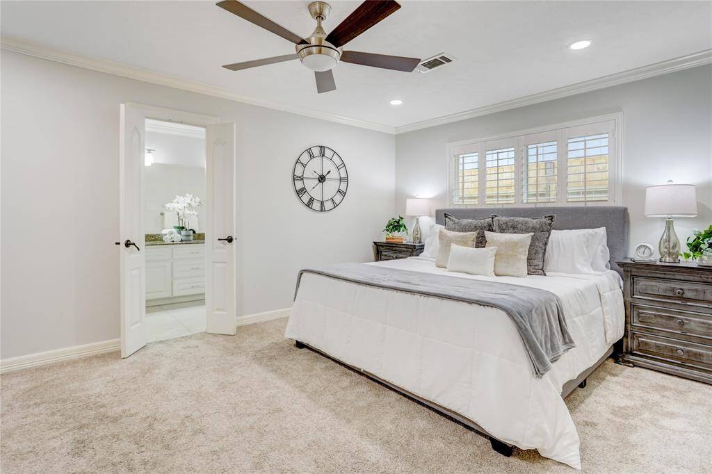 Tucked at the back of the house sits the primary suite with new recessed lighting, an updated shower, and walk-in closet.