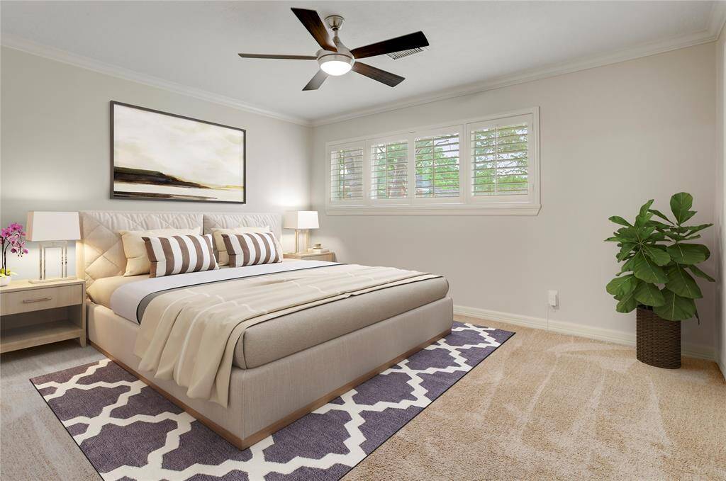Sitting on the front of the house is the larger of two secondary bedrooms. Virtually staged as a guest room, you'll appreciate the size and natural light in this space.