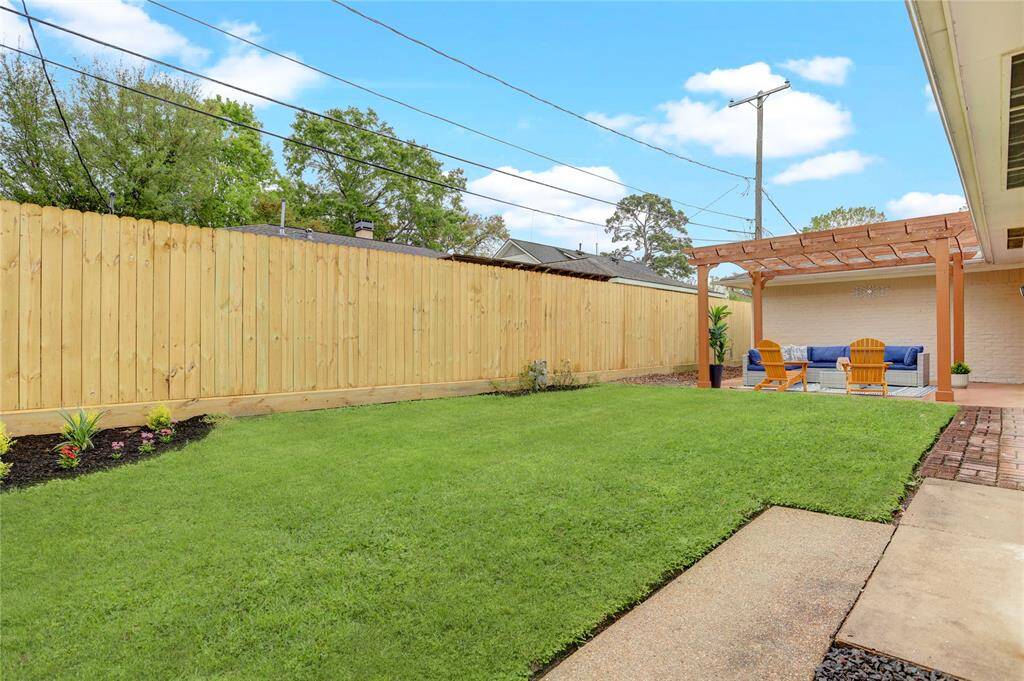 Another view of the backyard from the door exiting the utility room.