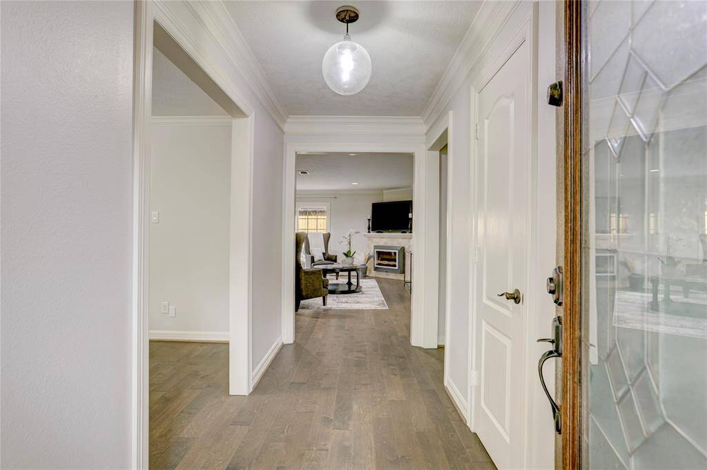 Upon entry, you're greeted by neutral colors and engineered hardwoods throughout all of the main spaces.